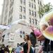 Donna (right) and her granddaughter Alex, two, enjoy bubbles in the intersection of Washington and Main on Saturday. Daniel Brenner I AnnArbor.com